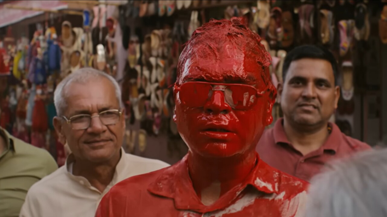 Truecaller advertisement that personifies the red button feature in their app which blocks fraud calls, by painting the face red