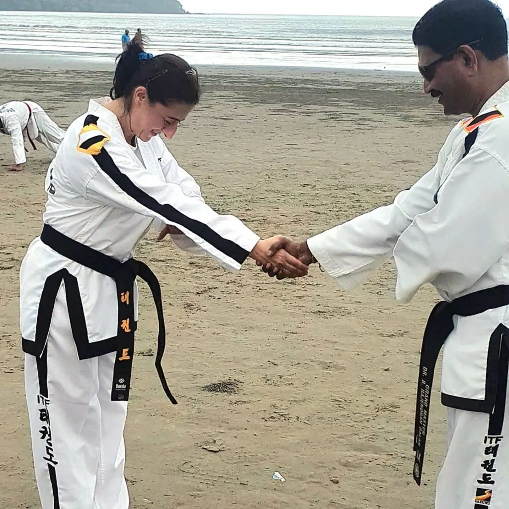 Neeral Trivedi receiving 5th Dan Black belt from Grand Master Rajendran Balan.