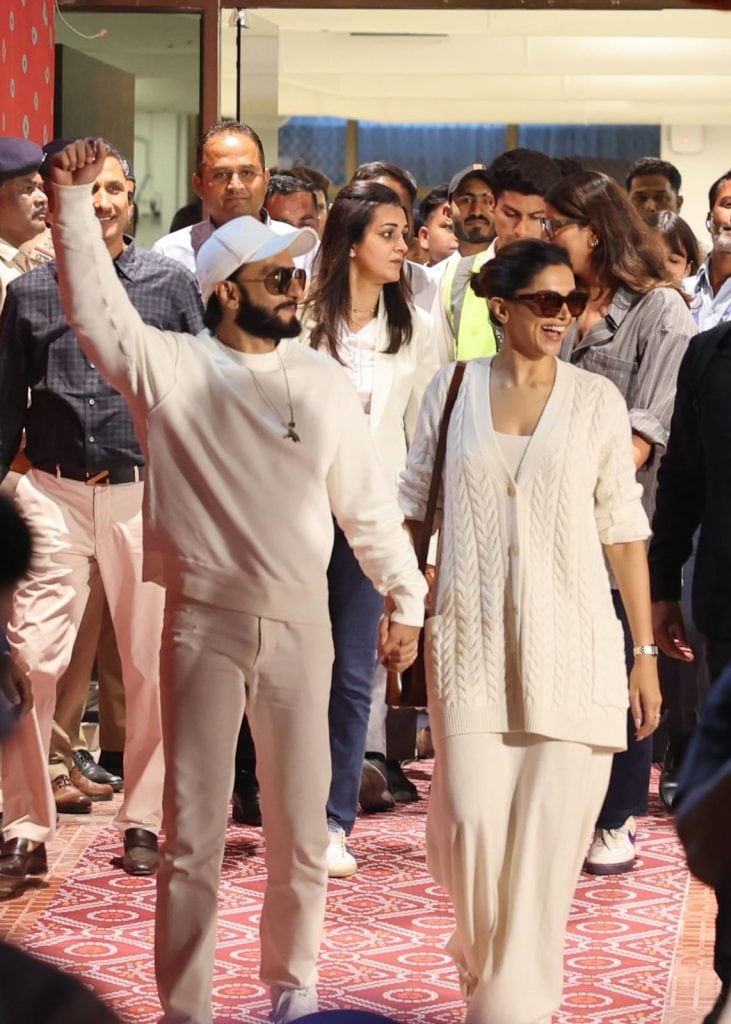 Bollywood actors Ranveer Singh and Deepika Padukone arrive hand-in-hand.