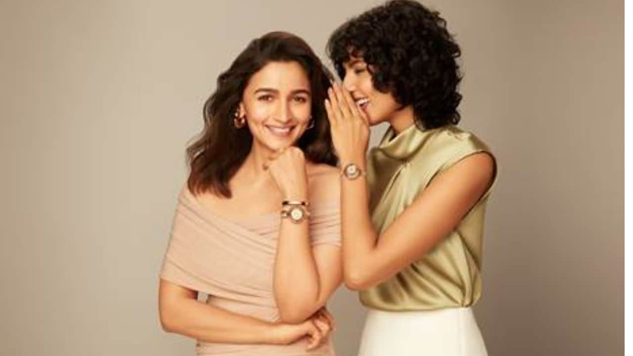 Alia Bhatt is seen interacting with women around her. From complimenting a stranger in an elevator, sharing a tender moment of exchanging a Raga timepiece with a friend to enhance her attire, and to supporting another facing a fashion mishap at a social event.