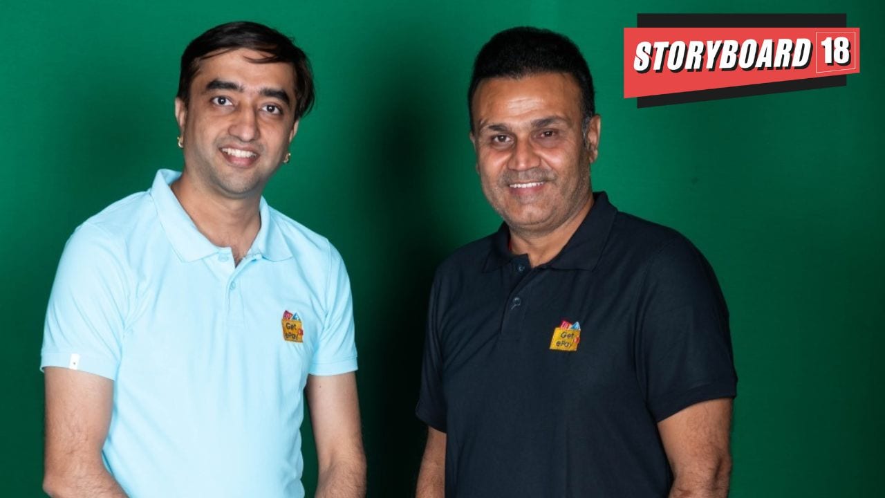 Pravin Sharma, Founder and CEO of Getepay (L) and legendary cricketer Virendra Sehwag (R)