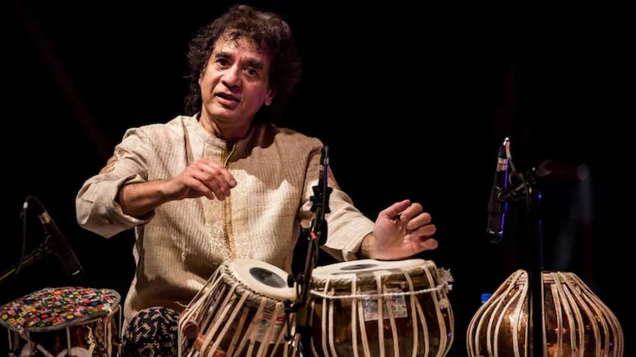 Zakir Hussain’s passing is personal. That he was a musical genius who owned rhythm and time, was synonymous with the instrument and had won multiple awards including six Grammys, everyone knows, writes Mangalam Maloo. (Image Source: Moneycontrol)