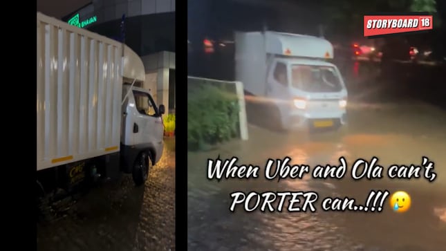 A now-viral video circulating on social media shows formally dressed professionals navigating the waterlogged streets atop a Porter mini truck.