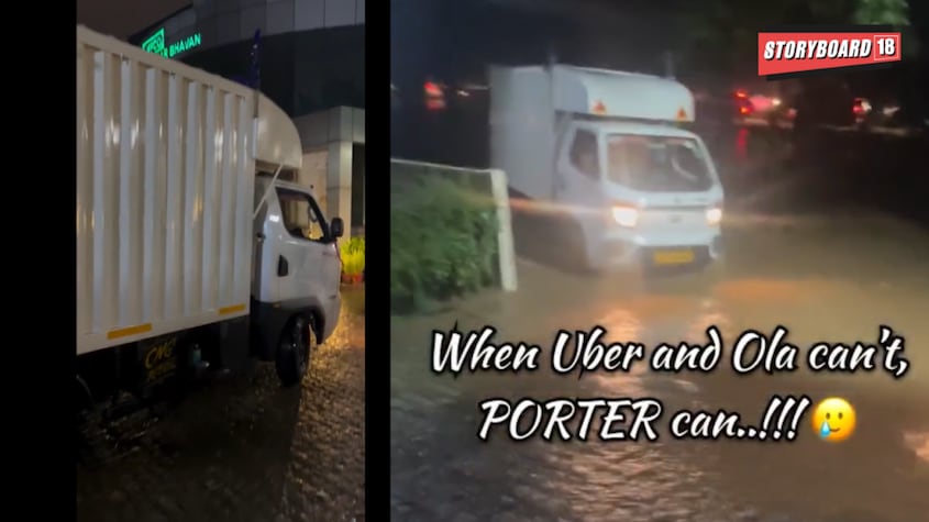 A now-viral video circulating on social media shows formally dressed professionals navigating the waterlogged streets atop a Porter mini truck.